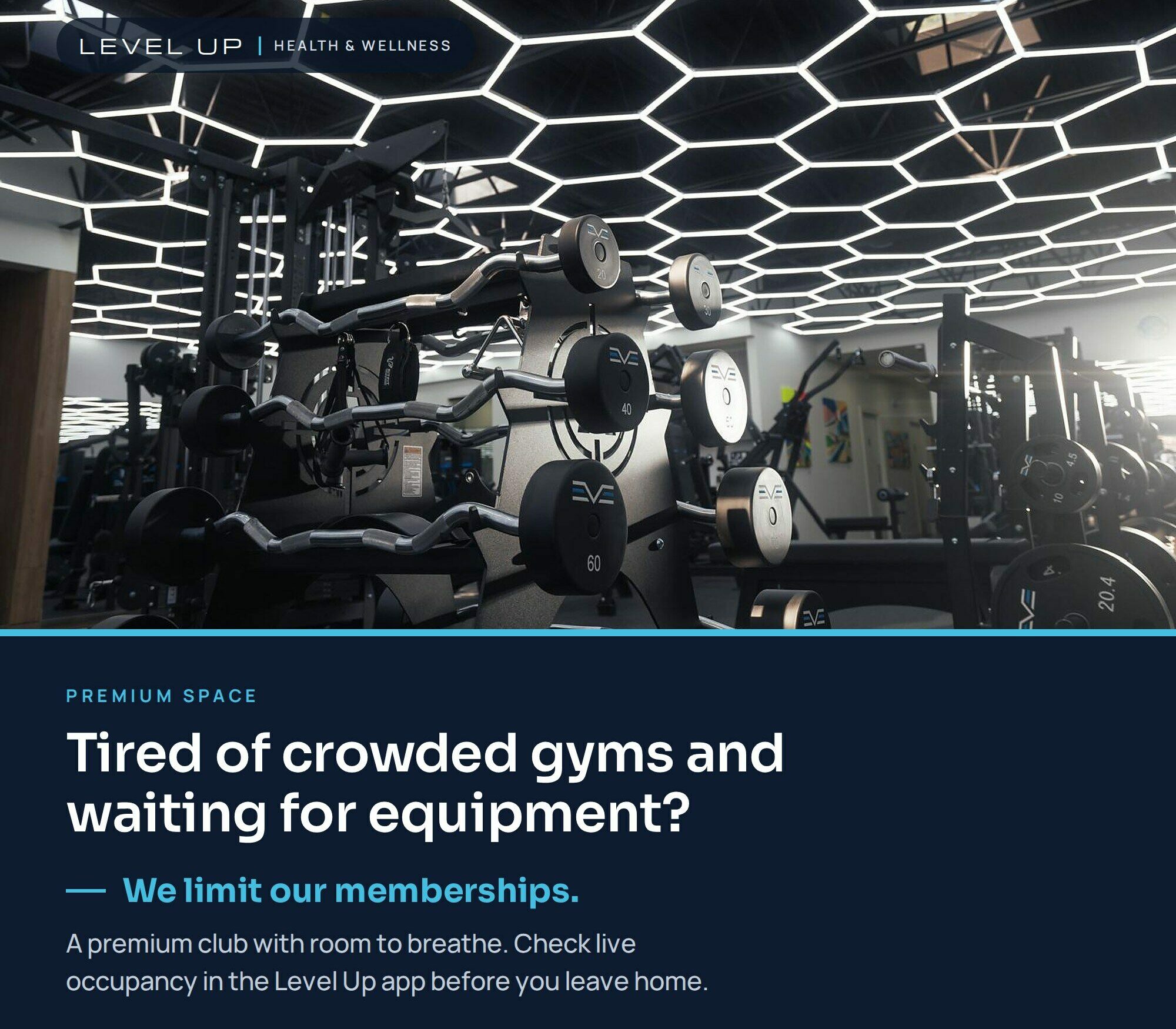 Premium Level Up gym interior with strength equipment and geometric ceiling lights. Limited memberships and live occupancy tracking in the app provide room to train. Register for the October offer.